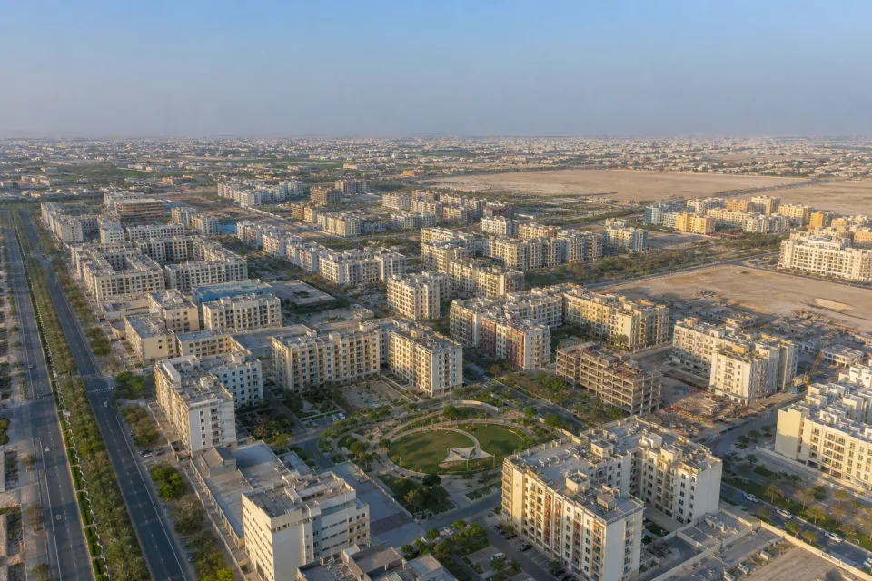 Illustrative aerial overview of apartment neighbourhoods and developing plots in Al Warsan 4, Dubai