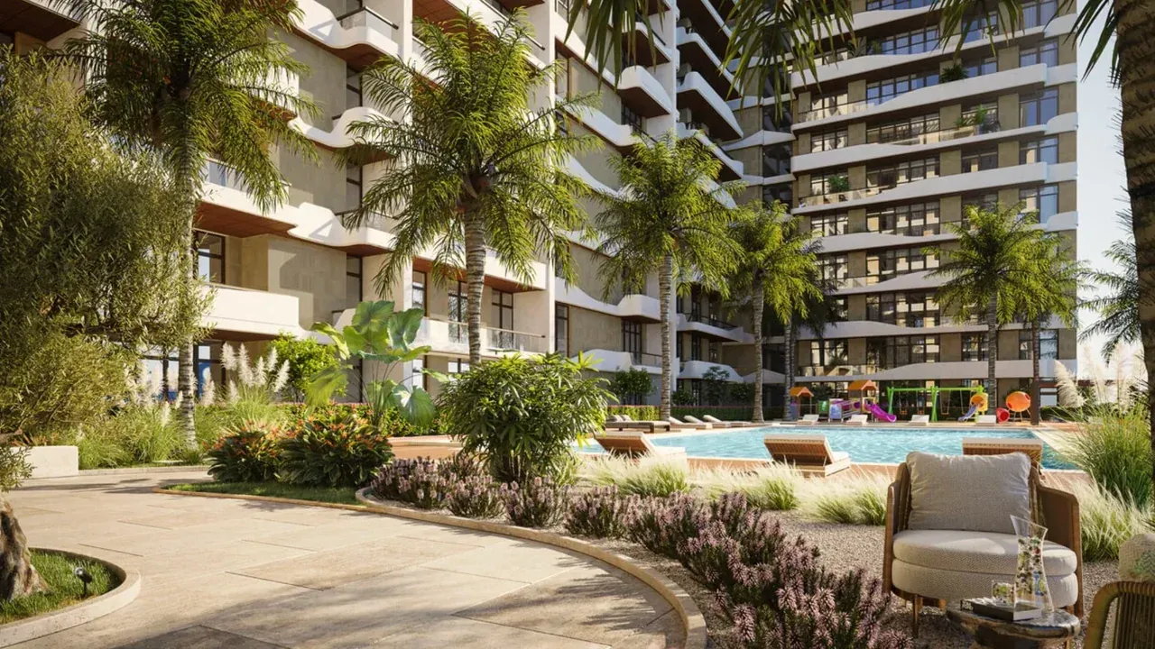 Landscaped swimming pool and residential buildings at a DHG development