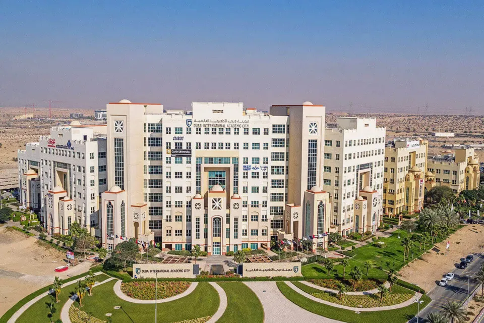Aerial view of university buildings and landscaped campuses in Dubai International Academic City
