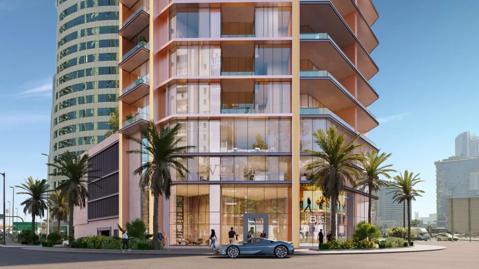 Street-level view of the bronze-toned Velor residential tower by GINCO Properties