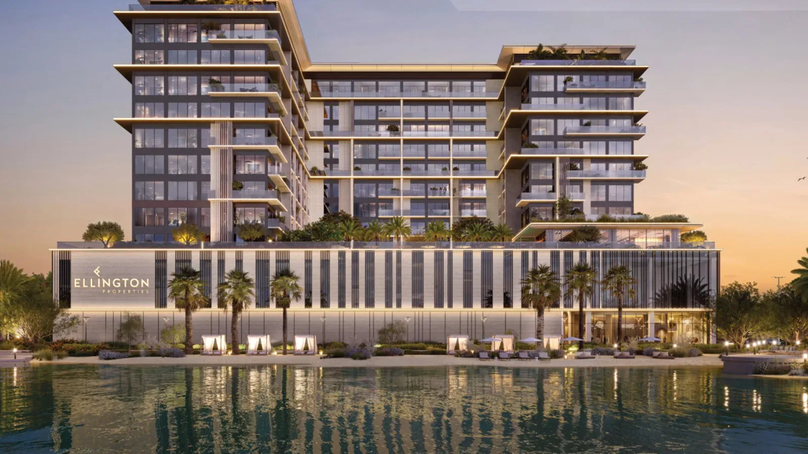 Everly Place by Ellington Properties beside the Meydan Horizon crystal lagoon at dusk.