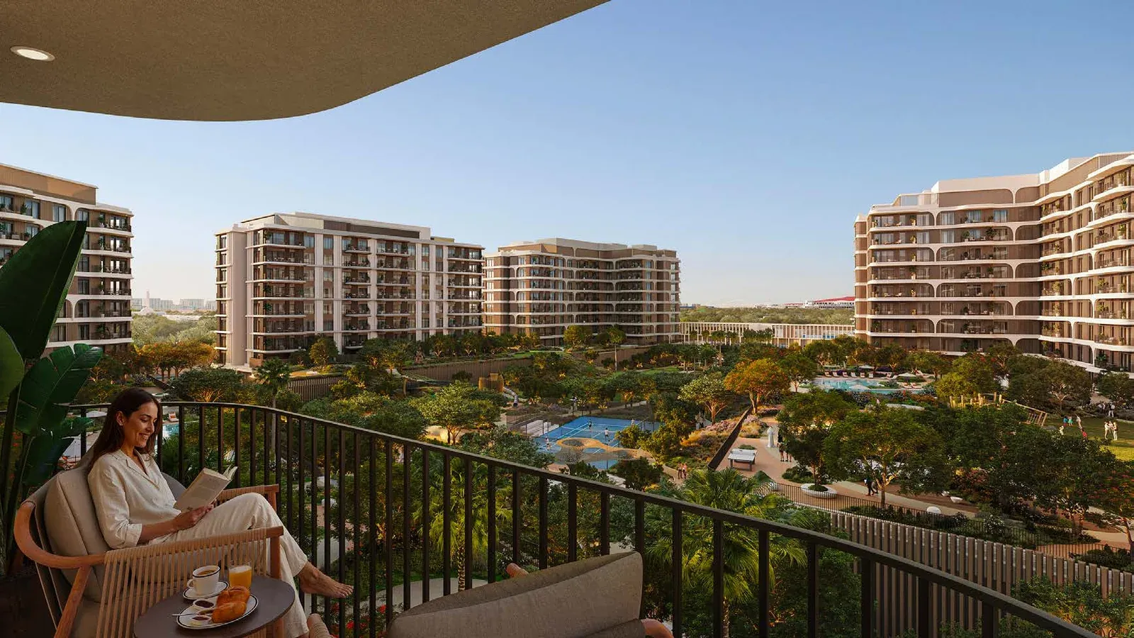 View from a private balcony across the landscaped gardens and apartment buildings at The Canopies at Yas Point.