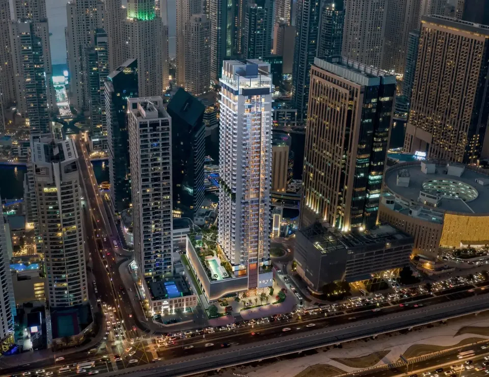 Rove Home Dubai Marina tower and landscaped podium at dusk by IRTH Development