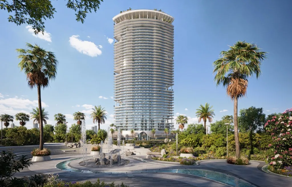 Landscaped gardens and curved tower facade of Azure by Lapis in RAK Central