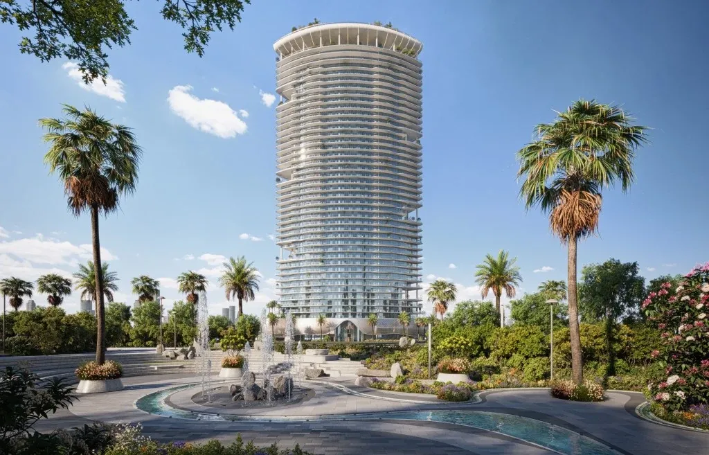 Landscaped gardens and curved tower facade of Azure by Lapis in RAK Central