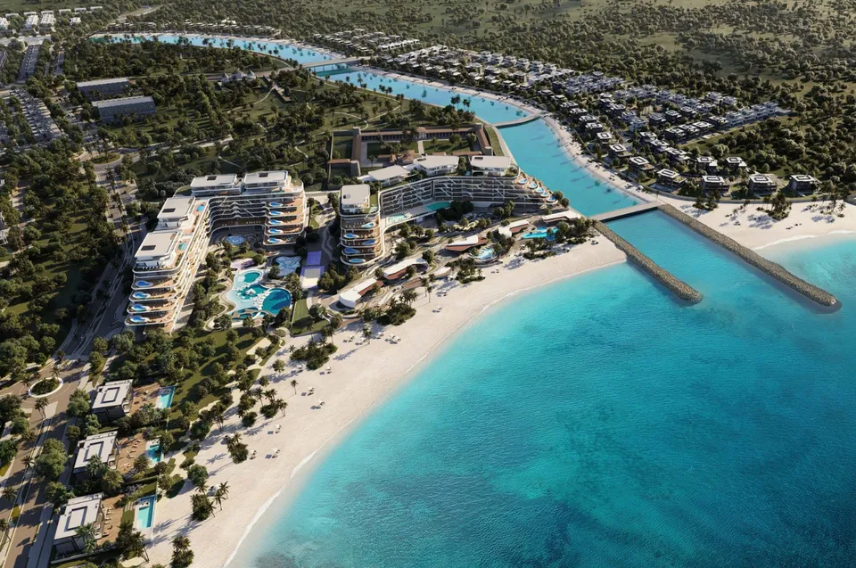 Aerial exterior of Jacob & Co. Beachfront Living by Ohana beside the beach and canal in Al Jurf, Abu Dhabi