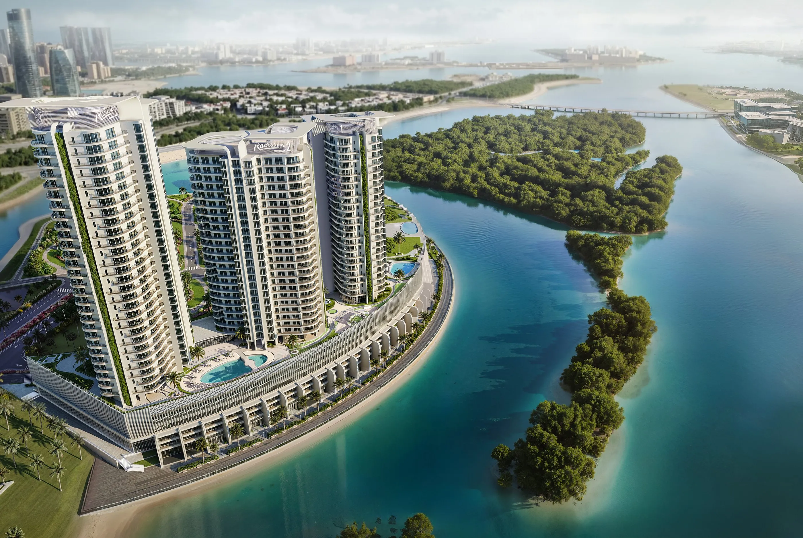 Aerial view of the three Radisson Residences towers and waterfront podium on Al Reem Island