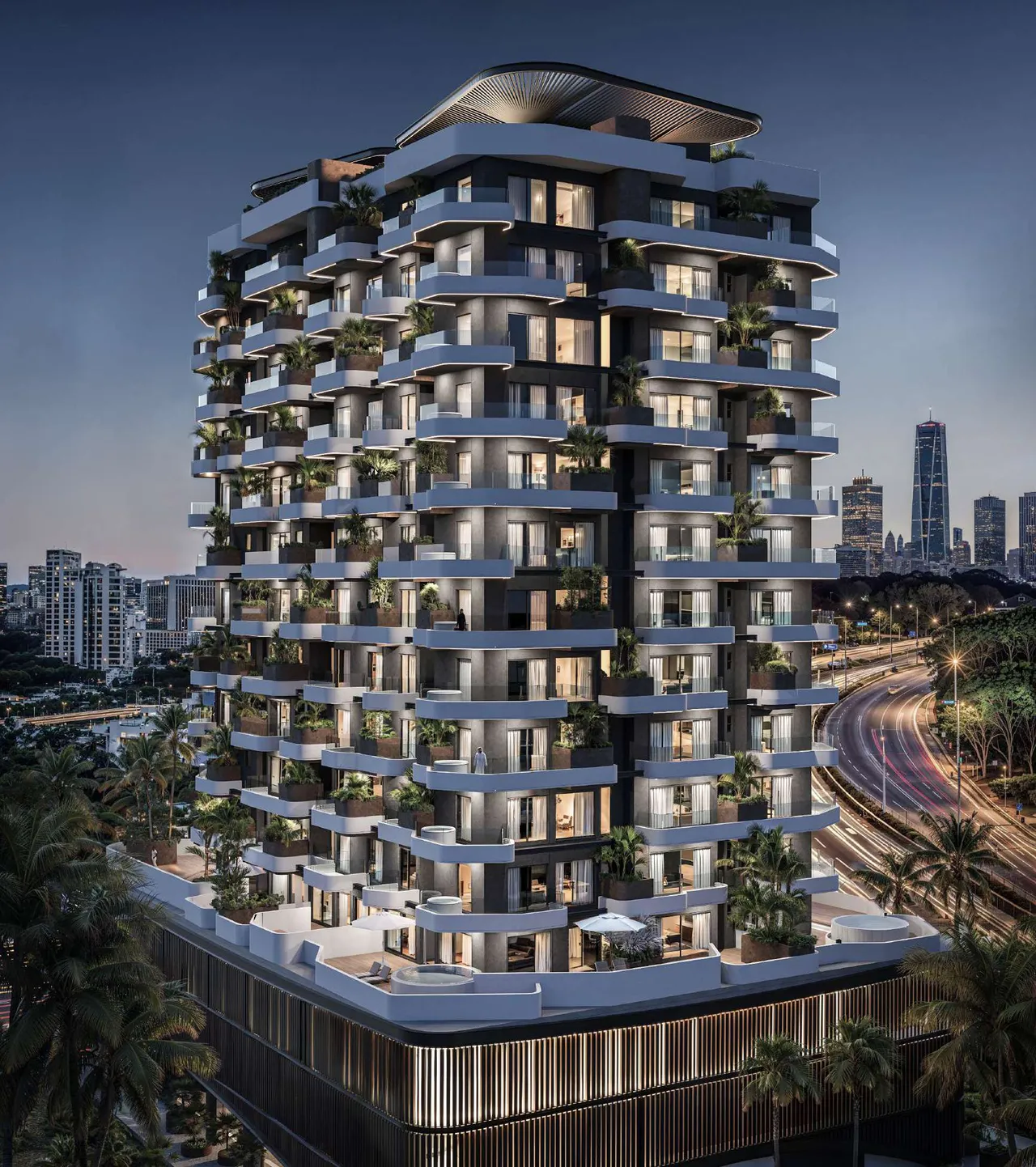 Marea Residence exterior at twilight with illuminated balconies by Sharafi Development