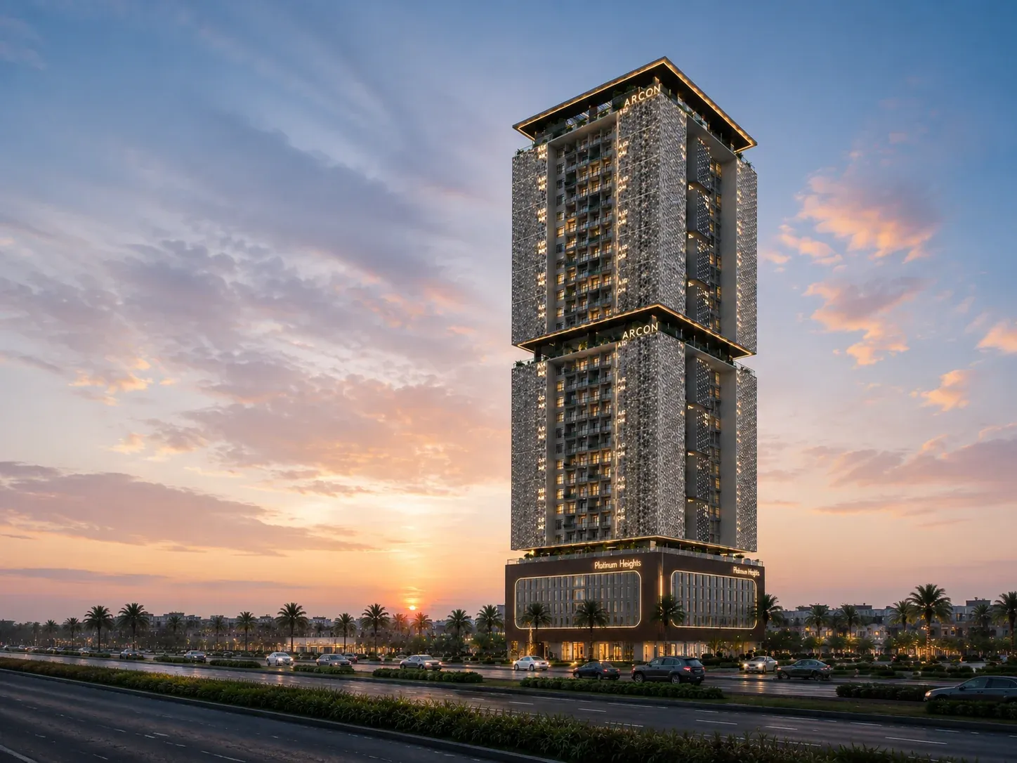 Platinum Heights residential tower illuminated against a sunset sky in Ajman