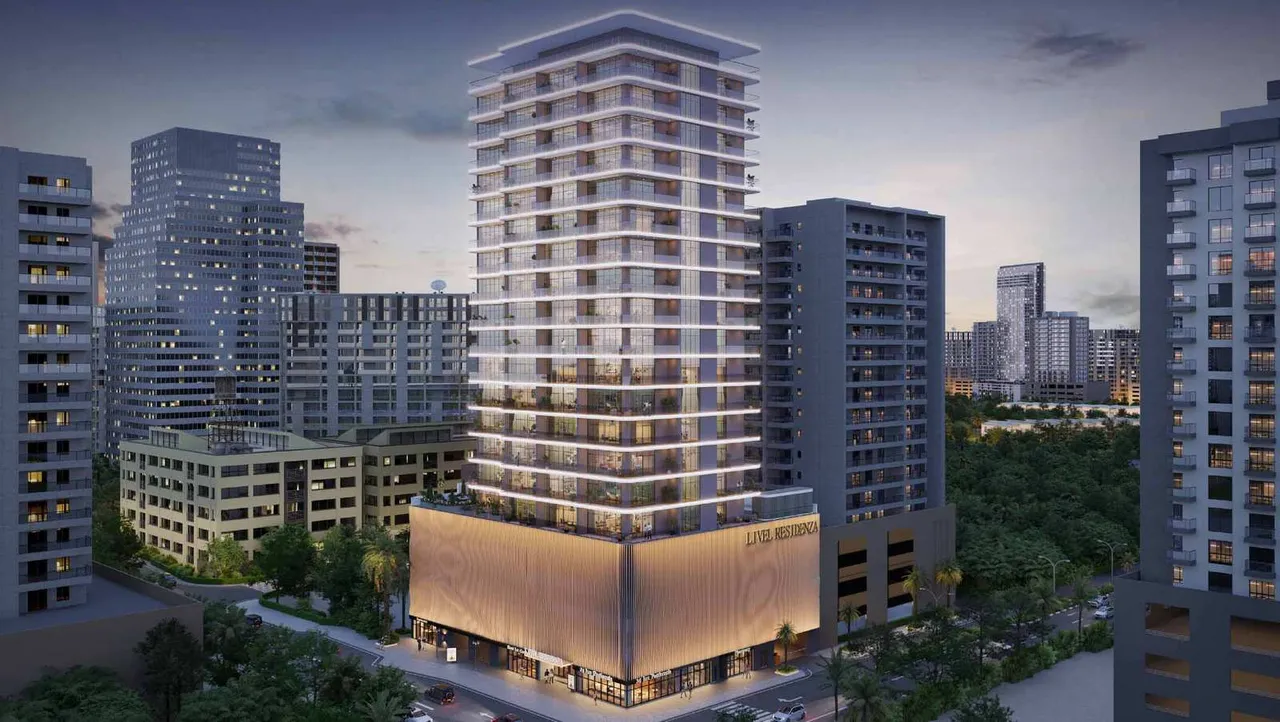 Livel Residenza tower and podium at dusk in Jumeirah Village Circle by Vantage Properties