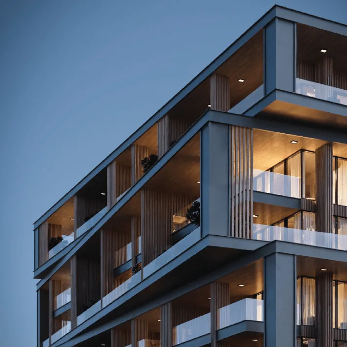 Illuminated balconies and angular facade of Uno Luxe by WOW Resorts on Al Marjan Island